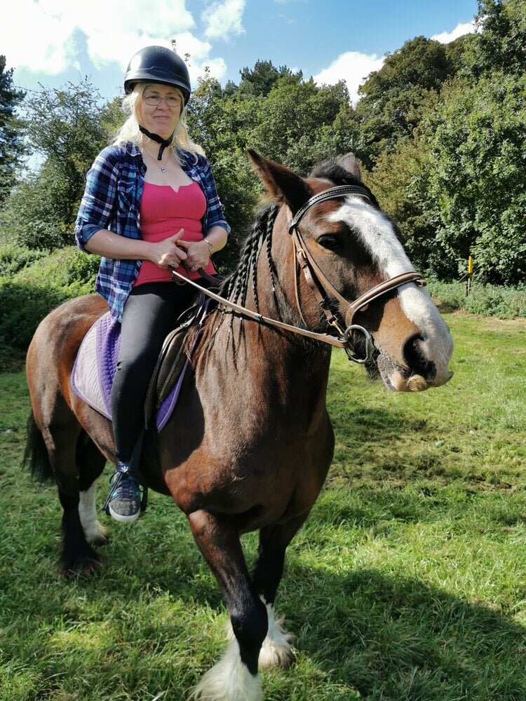 woman-riding-a-horse-at-the-farm.jpeg